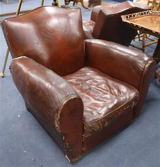 A pair of leather club armchairs